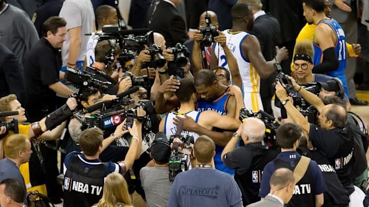 May 30, 2016; Oakland, CA, USA; Golden State Warriors guard Stephen Curry (30) and Oklahoma City Thunder forward Kevin Durant (35) hug after game seven of the Western conference finals of the NBA Playoffs at Oracle Arena. The Golden State Warriors defeated the Oklahoma City Thunder 96-88. Mandatory Credit: Kelley L Cox-USA TODAY Sports