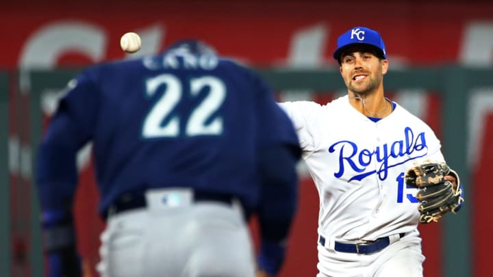 Apr 10, 2018; Kansas City, MO, USA; Kansas City Royals second baseman Whit Merrifield (15) throws to first base as Seattle Mariners second baseman Robinson Cano (22) runs toward second base in the fourth inning at Kauffman Stadium. Mandatory Credit: Jay Biggerstaff-USA TODAY Sports