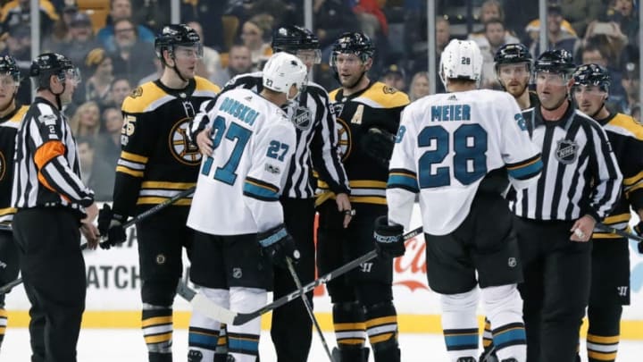 BOSTON, MA - OCTOBER 26: San Jose Sharks left wing Joonas Donskoi (27) is held back from Boston Bruins center David Backes (42) by linesman Matt McPherson (83) during a game between the Boston Bruins and the San Jose Sharks on October 26, 2017, at TD Garden in Boston, Massachusetts. The Bruins defeated the Sharks 2-1. (Photo by Fred Kfoury III/Icon Sportswire via Getty Images)