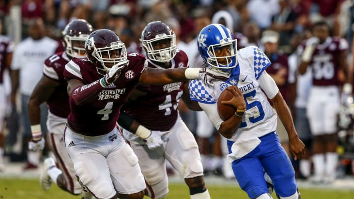 STARKVILLE, MS – OCTOBER 21: Stephen Johnson #15 of the Kentucky Wildcats is brought down by Gerri Green #4 of the Mississippi State Bulldogs as he scrambles for a first down during the second half of an NCAA football game at Davis Wade Stadium on October 21, 2017 in Starkville, Mississippi. (Photo by Butch Dill/Getty Images)