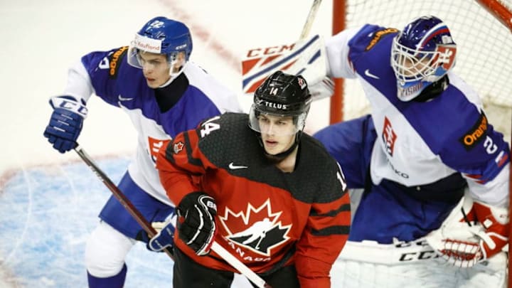 VICTORIA , BC - DECEMBER 21: Maxime Comtois #14 of Team Canada positions himself in front of Adam Ziak #22 and goaltender Samuel Hlavaj #2 of Team Slovakia at the IIHF World Junior Championships at the Save-on-Foods Memorial Centre on December 21, 2018 in Victoria, British Columbia, Canada. (Photo by Kevin Light/Getty Images)