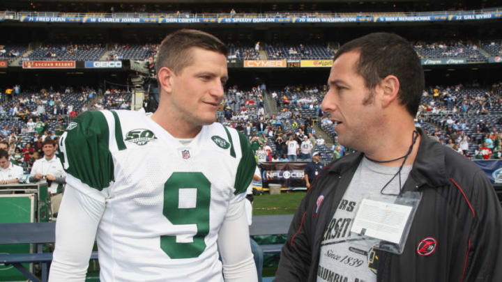 SAN DIEGO – JANUARY 17: Actor Adam Sandler meets with Punter Steve Weatherford #9 of the New York Jets on the sideline before the start of the AFC Divisional Playoff game between the New York Jets and San Diego Chargers at Qualcomm Stadium on January 17, 2010 in San Diego, California. (Photo by Al Pereira/WireImage)