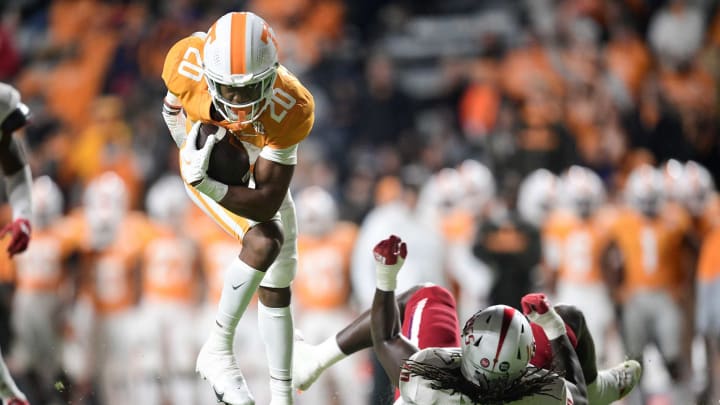 Tennessee running back Jaylen Wright (20) shrugs off South Alabama defensive lineman Charles Coleman III (30) on a run play in the NCAA football game between the Tennessee Volunteers and South Alabama Jaguars in Knoxville, Tenn. on Saturday, November 20, 2021.Utvsal1120