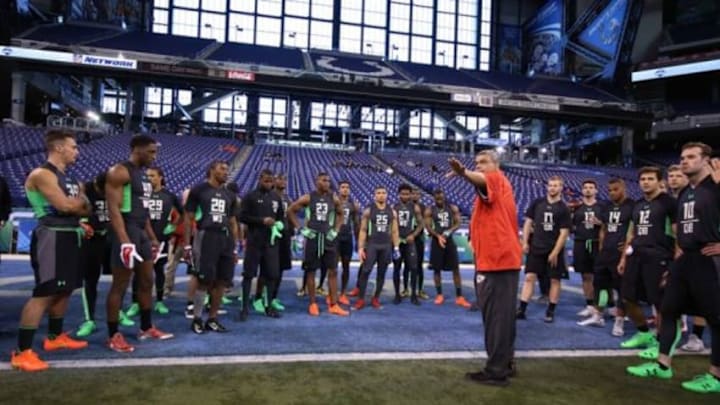 Feb 27, 2016; Indianapolis, IN, USA; Quarterbacks and wide receivers get instructions on the workout drills during the 2016 NFL Scouting Combine at Lucas Oil Stadium. Mandatory Credit: Brian Spurlock-USA TODAY Sports