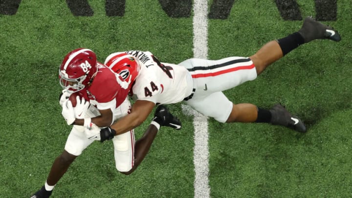Travon Walker tackles Agiye Hall #84 of the Alabama Crimson Tide during the second quarter in the 2022 CFP National Championship Game at Lucas Oil Stadium on January 10, 2022 in Indianapolis, Indiana. (Photo by Dylan Buell/Getty Images)