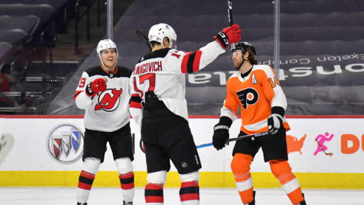 Mar 23, 2021; Philadelphia, Pennsylvania, USA; New Jersey Devils center Yegor Sharangovich (17) celebrates his goal with center Janne Kuokkanen (59) against the Philadelphia Flyers during the second period at Wells Fargo Center. Mandatory Credit: Eric Hartline-USA TODAY Sports