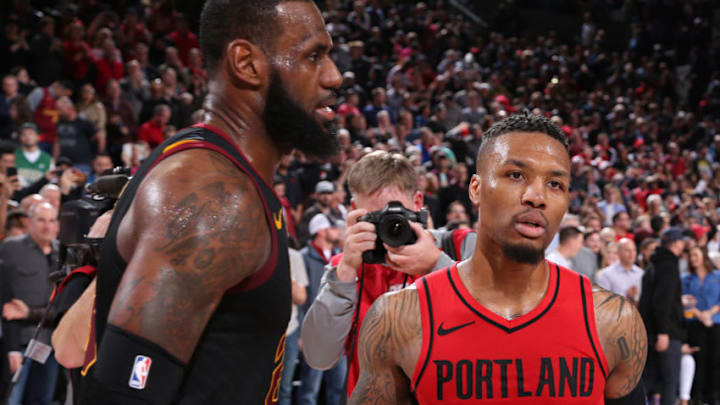 PORTLAND, OR - MARCH 15: LeBron James #23 of the Cleveland Cavaliers and Damian Lillard #0 of the Portland Trail Blazers greet each other coming off the court after the game on March 15, 2018 at the Moda Center in Portland, Oregon. NOTE TO USER: User expressly acknowledges and agrees that, by downloading and or using this Photograph, user is consenting to the terms and conditions of the Getty Images License Agreement. Mandatory Copyright Notice: Copyright 2018 NBAE (Photo by Sam Forencich/NBAE via Getty Images)