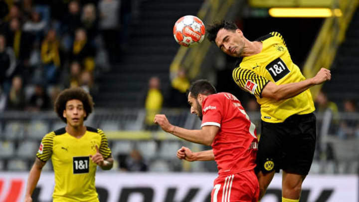 Dortmund’s Belgian midfielder Axel Witsel (L) looks on as Dortmund’s German defender Mats Hummels (R) and Union Berlin’s German midfielder Levin Oeztunali vie for the ball during the German first division Bundesliga football match Borussia Dortmund vs FC Union Berlin on September 19, 2021 in Dortmund, western Germany. (Photo by INA FASSBENDER/AFP via Getty Images)