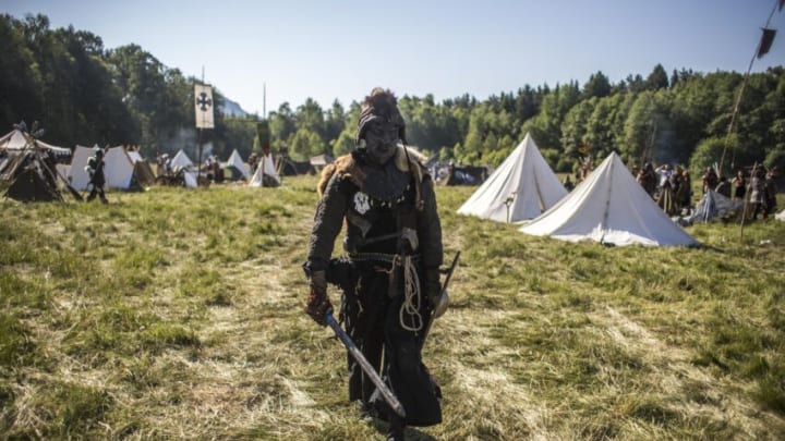 DOKSY, CZECH REPUBLIC - JUNE 06: A participant dressed as orc, character from "The Hobbit" book by J. R. R. Tolkien arrives for the reenactment of the "Battle of Five Armies" in a forest on June 6, 2015 near Doksy village, Czech Republic. Hundreds of Czech enthusiasts re-enacted the battle of men, elves and dwarves against goblins and wargs. An English writer John Ronald Reuel Tolkien published "The Hobbit" for the first time in 1937. (Photo by Matej Divizna/Getty Images)