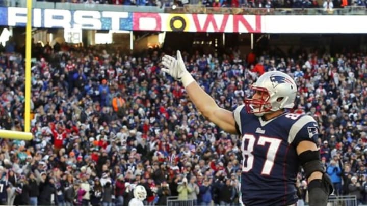 Dec 14, 2014; Foxborough, MA, USA; New England Patriots tight end Rob Gronkowski (87) signals for a first down to the crowd during the second half against the Miami Dolphins at Gillette Stadium. The Patriots won 41-13. Mandatory Credit: Winslow Townson-USA TODAY Sports