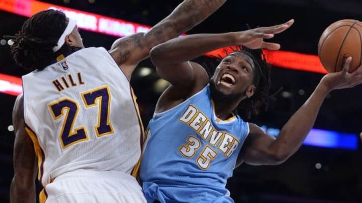 Nov 23, 2014; Los Angeles, CA, USA; Los Angeles Lakers center Jordan Hill (27) defends a shot by Denver Nuggets forward Kenneth Faried (35) in the second half of the game at Staples Center. Nuggets won 101-94. Mandatory Credit: Jayne Kamin-Oncea-USA TODAY Sports