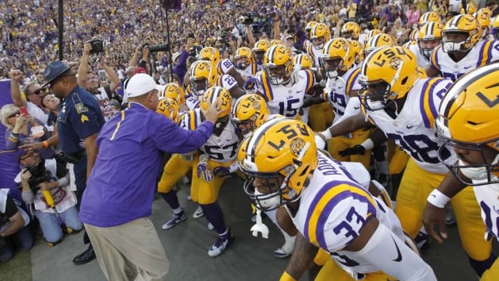 Oct 17, 2015; Baton Rouge, LA, USA; LSU Tigers head coach Les Miles leads the Tigers onto the field prior to kickoff against the Florida Gators at Tiger Stadium. The LSU Tigers defeated Florida 35-28. Mandatory Credit: Crystal LoGiudice-USA TODAY Sports