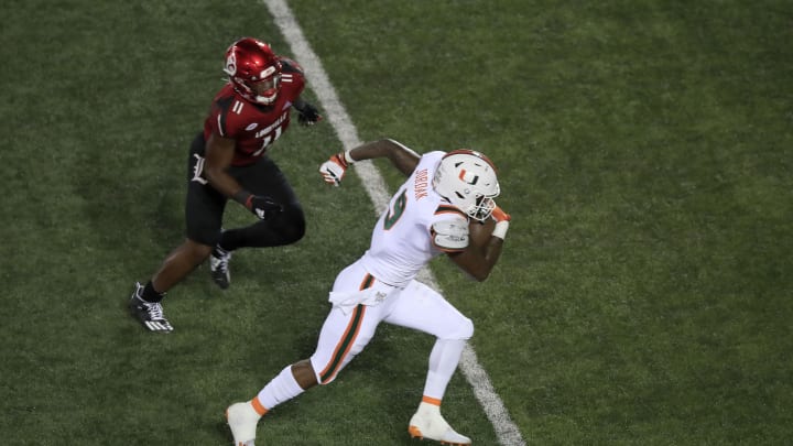 LOUISVILLE, KENTUCKY – SEPTEMBER 19: Brevin Jordan #9 of the Miami Hurricanes runs the ball against the Louisville Cardinals at Cardinal Stadium on September 19, 2020 in Louisville, Kentucky. (Photo by Andy Lyons/Getty Images)