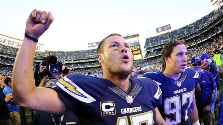 Dec 29, 2013; San Diego, CA, USA; San Diego Chargers quarterback Philip Rivers (17) celebrates after a win against the Kansas City Chiefs at Qualcomm Stadium. The Chargers won 27-24 in overtime. Mandatory Credit: Christopher Hanewinckel-USA TODAY Sports