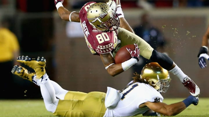 TALLAHASSEE, FL – OCTOBER 18: Rashad Greene #80 of the Florida State Seminoles is hit by Matthias Farley #41 of the Notre Dame Fighting Irish during their game at Doak Campbell Stadium on October 18, 2014, in Tallahassee, Florida. (Photo by Streeter Lecka/Getty Images)