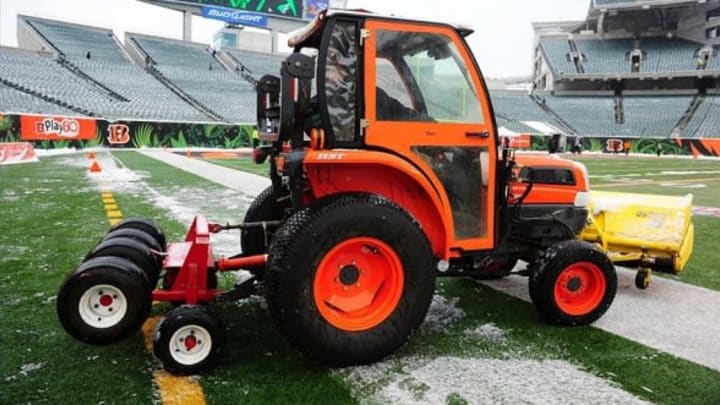 Dec 8, 2013; Cincinnati, OH, USA; A tractor removes snow from the field prior to the game between the Indianapolis Colts and Cincinnati Bengals at Paul Brown Stadium. Mandatory Credit: Andrew Weber-USA TODAY Sports