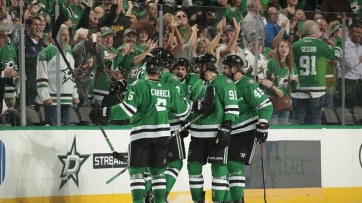 DALLAS, TX - OCTOBER 4: Connor Carrick #5, Jamie Benn #14, Tyler Seguin #91 and the Dallas Stars celebrate a goal against the Arizona Coyotes at the American Airlines Center on October 4, 2018 in Dallas, Texas. (Photo by Glenn James/NHLI via Getty Images)