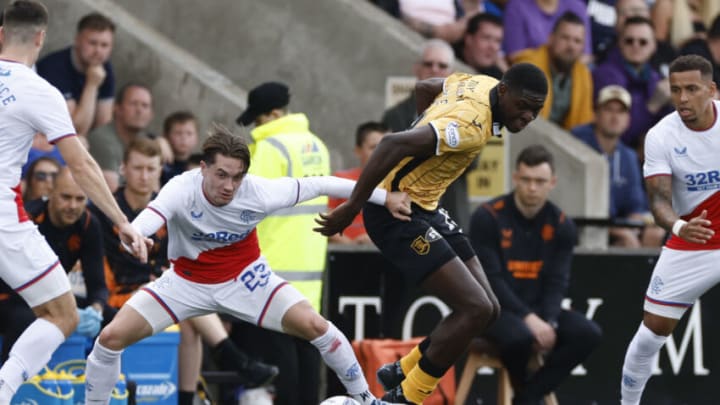 LIVINGSTON, SCOTLAND - JULY 30: Joel Nouble of Livingston tackles Scott Wright of Rangers during the Cinch Scottish Premiership match between Livingston FC and Rangers FC at on July 30, 2022 in Livingston, United Kingdom. (Photo by Steve Welsh/Getty Images)