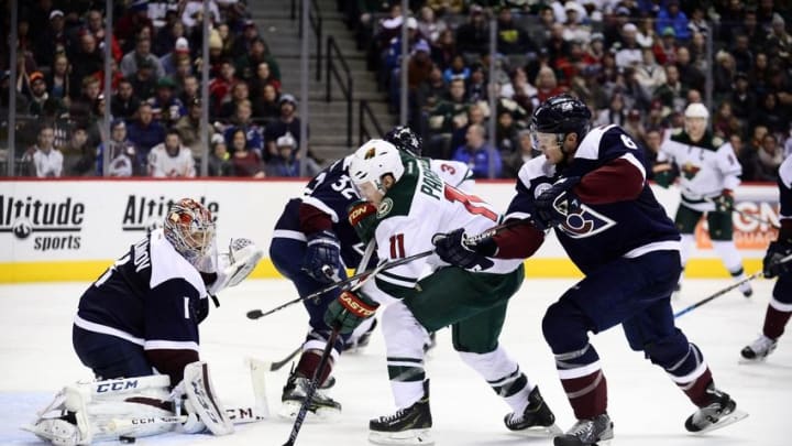 Mar 26, 2016; Denver, CO, USA; Minnesota Wild left wing Zach Parise (11) attempts to score on Colorado Avalanche goalie Semyon Varlamov (1) as defenseman Erik Johnson (6) defends from behind in the third period at the Pepsi Center. The Wild defeated the Avalanche 4-0. Mandatory Credit: Ron Chenoy-USA TODAY Sports