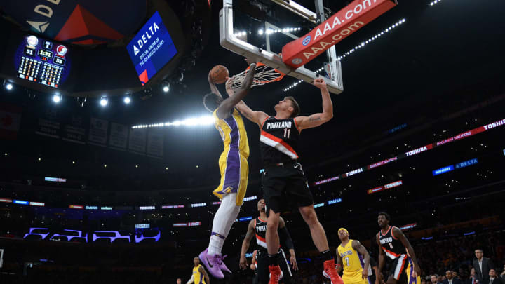 LOS ANGELES, CA – MARCH 05: Julius Randle #30 of the Los Angeles Lakers dunks against Meyers Leonard #11 of the Portland Trail Blazers during the first half of a basketball game at Staples Center on March 5, 2018 in Los Angeles, California. NOTE TO USER: User expressly acknowledges and agrees that, by downloading and or using this photograph, User is consenting to the terms and conditions of the Getty Images License Agreement. (Photo by Kevork Djansezian/Getty Images)