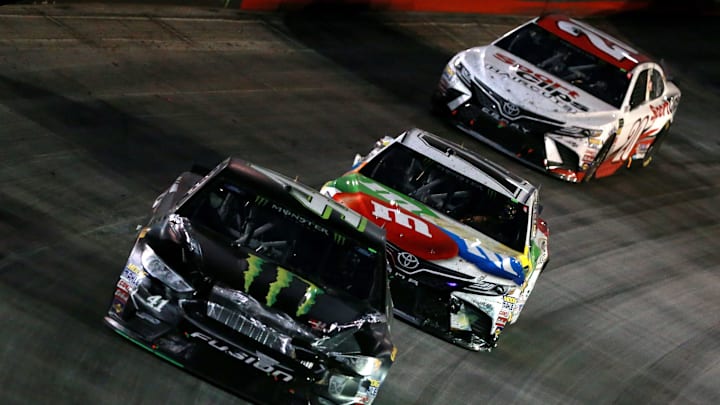 BRISTOL, TN – AUGUST 18: Kurt Busch, driver of the #41 Monster Energy/Haas Automation Ford, leads Kyle Busch, driver of the #18 M and M’s White Chocolate Toyota, and Paul Menard, driver of the #21 Menards/Knauf Ford (Photo by Sean Gardner/Getty Images)