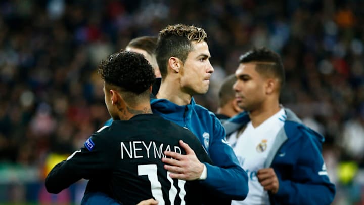 MADRID, SPAIN - FEBRUARY 14: Cristiano Ronaldo (L) of Real Madrid CF hugs Neymar JR (R) of Paris Saint-Germain prior to start the UEFA Champions League Round of 16 First Leg match between Real Madrid and Paris Saint-Germain at Estadio Santiago Bernabeu on February 14, 2018 in Madrid, Spain. (Photo by Gonzalo Arroyo Moreno/Getty Images)