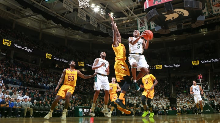 EAST LANSING, MI – NOVEMBER 14: Cassius Winston #5 of the Michigan State Spartans drives to the basket against Travis Munnings #1 of the Louisiana Monroe Warhawks at Breslin Center on November 14, 2018 in East Lansing, Michigan. (Photo by Rey Del Rio/Getty Images)