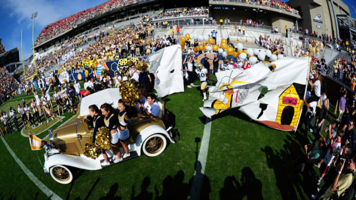 ATLANTA, GA - NOVEMBER 28: Members of the Georgia Tech Yellow Jackets Cheerleaders lead the team onto the field before the game against the Georgia Bulldogs at Bobby Dodd Stadium on November 28, 2015 in Atlanta, Georgia. (Photo by Scott Cunningham/Getty Images)