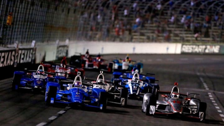 FORT WORTH, TX - JUNE 10: Will Power, driver of the #12 Verizon Team Penske Chevrolet, and Scott Dixon, driver of the #9 NTT Data Chip Ganassi Racing Honda, lead the field during the Verizon IndyCar Series Rainguard Water Sealers 600 at Texas Motor Speedway on June 10, 2017 in Fort Worth, Texas. (Photo by Sean Gardner/Getty Images)