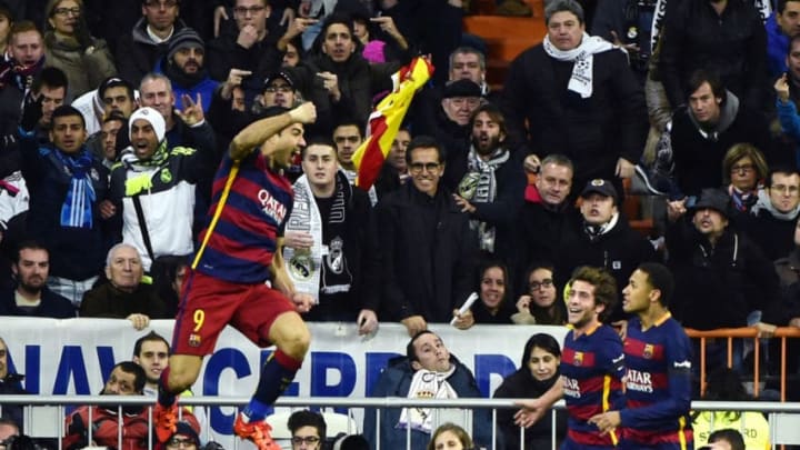 Barcelona’s Uruguayan forward Luis Suarez (L) celebrates next to teammates Barcelona’s Brazilian forward Neymar (R) and Barcelona’s midfielder Sergi Roberto during the Spanish league “Clasico” football match Real Madrid CF vs FC Barcelona at the Santiago Bernabeu stadium in Madrid on November 21, 2015. AFP PHOTO / PIERRE-PHILIPPE MARCOU / AFP / PIERRE-PHILIPPE MARCOU (Photo credit should read PIERRE-PHILIPPE MARCOU/AFP via Getty Images)