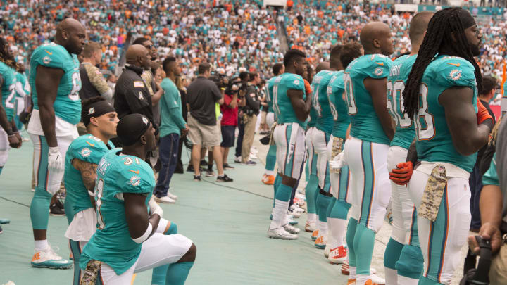 MIAMI GARDENS, FL – NOVEMBER 06: Miami Dolphins Safety Michael Thomas (31) and Miami Dolphins Wide Receiver Kenny Stills (10) kneel in protest during signing of the National Anthem during the NFL football game between the New York Jets and the Miami Dolphins on November 6, 2016, at the Hard Rock Stadium in Miami Gardens, FL. (Photo by Doug Murray/Icon Sportswire via Getty Images)