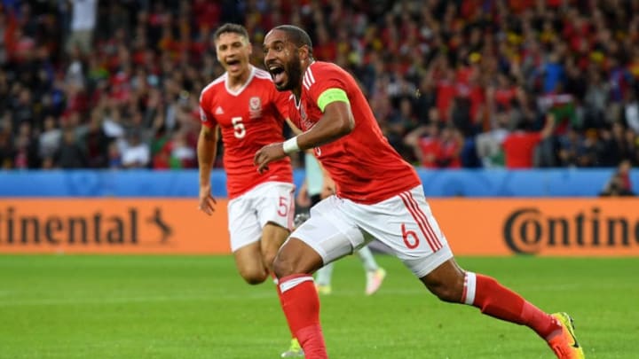 LILLE, FRANCE - JULY 01: Ashley Williams of Wales celebrates scoring his team's first goal during the UEFA EURO 2016 quarter final match between Wales and Belgium at Stade Pierre-Mauroy on July 1, 2016 in Lille, France. (Photo by Matthias Hangst/Getty Images)