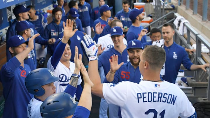 LOS ANGELES, CA - MARCH 30: Joc Pederson #31 of the Los Angeles Dodgers is congratulated for his first inning home run against the Arizona Diamondbacks at Dodger Stadium on March 30, 2019 in Los Angeles, California. (Photo by John McCoy/Getty Images)