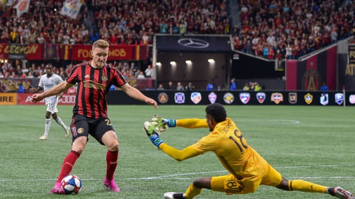 ATLANTA, GA - OCTOBER 24: Atlanta's Julian Gressel (24) shoots over Philadelphia goalkeeper Andre Blake (18) and scores a goal during the MLS playoff match between Philadelphia Union and Atlanta United FC on October 24th, 2019 at Mercedes-Benz Stadium in Atlanta, GA. (Photo by Rich von Biberstein/Icon Sportswire via Getty Images)