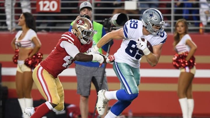 SANTA CLARA, CA - AUGUST 09: Blake Jarwin #89 of the Dallas Cowboys fights off the tackle of Elijah Lee #47 of the San Francisco 49ers to take the ball down to the one yard line in the second quarter of their NFL preseason football game at Levi's Stadium on August 9, 2018 in Santa Clara, California. (Photo by Thearon W. Henderson/Getty Images)