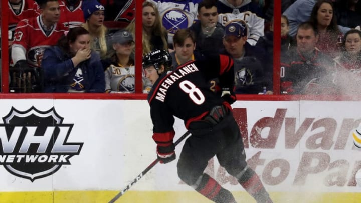 RALEIGH, NC - JANUARY 11: Saku Maenalanen #8 of the Carolina Hurricanes plays the puck along the boards during an NHL game against the Buffalo Sabres on January 11 ,2019 at PNC Arena in Raleigh, North Carolina. (Photo by Gregg Forwerck/NHLI via Getty Images)