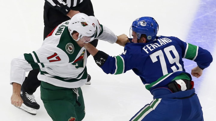 Marcus Foligno of the Minnesota Wild fights Micheal Ferland of the Vancouver Canucks (by Jeff Vinnick/Getty Images)