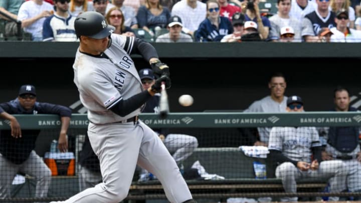 BALTIMORE, MD - APRIL 7: New York Yankees catcher Gary Sanchez (24) hits a home run during the game between the New York Yankees and the Baltimore Orioles on April 7, 2019, at Orioles Park at Camden Yards in Baltimore, MD. (Photo by Mark Goldman/Icon Sportswire via Getty Images)