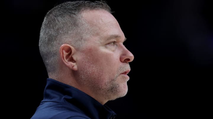 DENVER, COLORADO – APRIL 21: Head coach Michael Malone of the Denver Nuggets watches as his team plays the Golden State Warriors in the fourth quarter during Game Three of the Western Conference First Round NBA Playoffs at Ball Arena on April 21, 2022 in Denver, Colorado. (Photo by Matthew Stockman/Getty Images)
