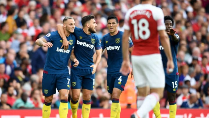 LONDON, ENGLAND - AUGUST 25: Marko Arnautovic of West Ham United celebrates with teammates after he scores his sides first goal during the Premier League match between Arsenal FC and West Ham United at Emirates Stadium on August 25, 2018 in London, United Kingdom. (Photo by Clive Mason/Getty Images)