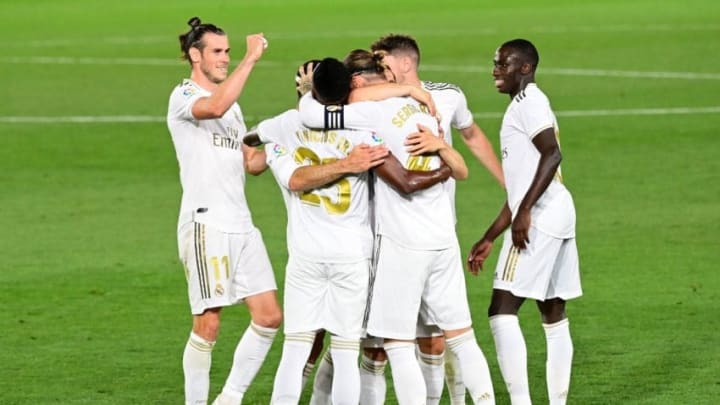 Real Madrid's Spanish defender Sergio Ramos (C) celebrates with teammates after scoring during the Spanish league football match real Real Madrid CF against RCD Mallorca at at the Alfredo di Stefano stadium in Valdebebas, on the outskirts of Madrid, on June 24, 2020. (Photo by JAVIER SORIANO / AFP) (Photo by JAVIER SORIANO/AFP via Getty Images)