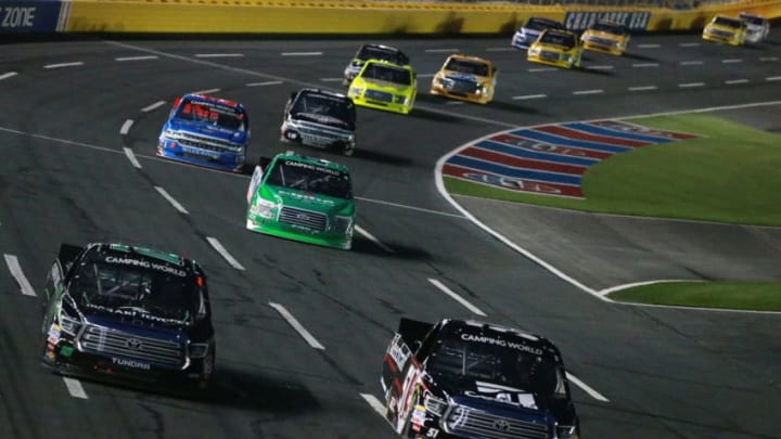 CHARLOTTE, NC - MAY 18: Kyle Busch, driver of the #51 Cessna Toyota, and Brett Moffitt, driver of the #16 Ibaraki Toyopet Toyota, lead a pack of trucks during the NASCAR Camping World Truck Series North Carolina Education Lottery 200 at Charlotte Motor Speedway on May 18, 2018 in Charlotte, North Carolina. (Photo by Sean Gardner/Getty Images)