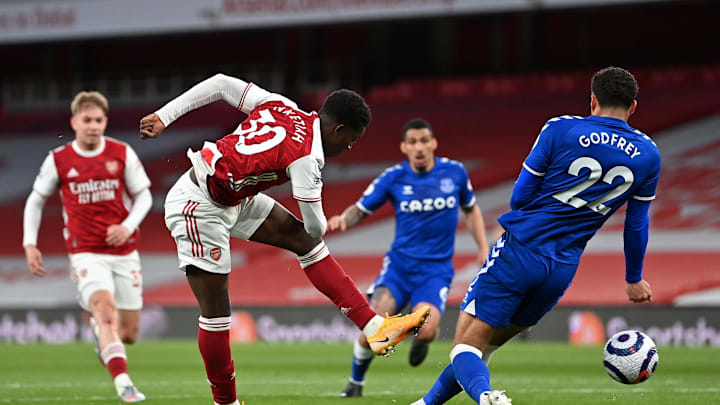 LONDON, ENGLAND – APRIL 23: Eddie Nketiah of Arsenal shoots whilst under pressure from Ben Godfrey of Everton during the Premier League match between Arsenal and Everton at Emirates Stadium on April 23, 2021 in London, England.