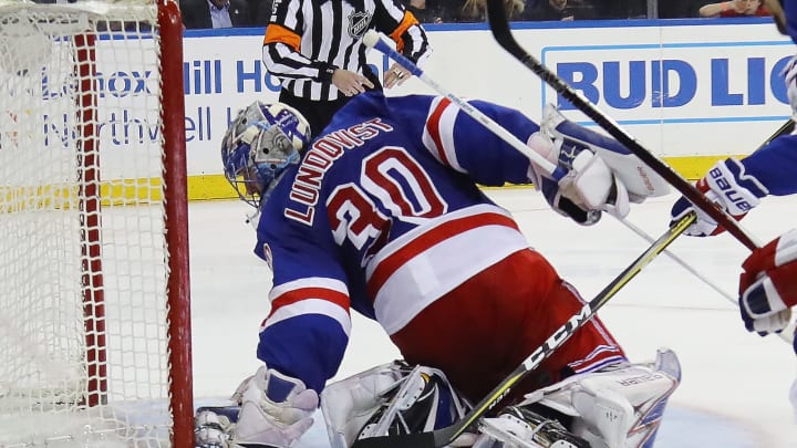 NEW YORK, NY – APRIL 18: Henrik Lundqvist #30 of the New York Rangers reaches behind himself to grab a shot by Alexander Radulov #47 of the Montreal Canadiens (Photo by Bruce Bennett/Getty Images)