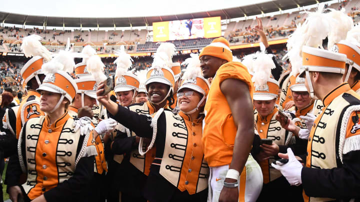 ***DUP***Tennessee quarterback Hendon Hooker (5)/Tennessee defensive back Kamal Hadden(5) stops for photographs with members of the Pride of the Southland Band after Tennessee’s win over Missouri in an NCAA college football game on Saturday, November 12, 2022 in Knoxville, Tenn.Ut Vs Missouri