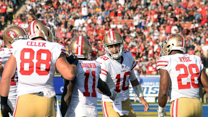 LOS ANGELES, CA - DECEMBER 31: Quarterback Jimmy Garoppolo #10 of the San Francisco 49ers congratulates Marquise Goodwin #11 of the San Francisco 49ers after scoring a touchdown during the first quarter against Los Angeles Rams at Los Angeles Memorial Coliseum on December 31, 2017 in Los Angeles, California. (Photo by Kevork Djansezian/Getty Images)