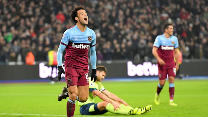 LONDON, ENGLAND - JANUARY 01: Felipe Anderson of West Ham United celebrates after scoring his team's fourth goal as Simon Francis of AFC Bournemouth reacts during the Premier League match between West Ham United and AFC Bournemouth at London Stadium on January 01, 2020 in London, United Kingdom. (Photo by Justin Setterfield/Getty Images)