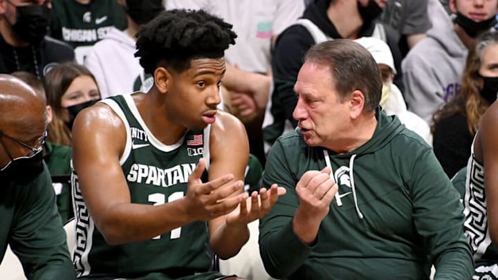 Dec 29, 2021; East Lansing, Michigan, USA; Michigan State Spartans head coach Tom Izzo (right) talks with guard A.J. Hoggard (11) in the first half against the High Point Panthers at Jack Breslin Student Events Center. Mandatory Credit: Dale Young-USA TODAY Sports