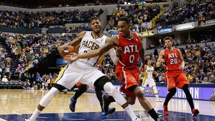 Feb 18, 2014; Indianapolis, IN, USA; Indiana Pacers forward Paul George (24) drives to the basket and gets fouled by Atlanta Hawks guard Jeff Teague (0) at Bankers Life Fieldhouse. Indiana defeats Atlanta 108-98. Mandatory Credit: Brian Spurlock-USA TODAY Sports