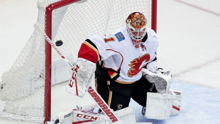 Dec 27, 2016; Denver, CO, USA; Calgary Flames goalie Brian Elliott (1) deflects the puck in the third period against the Colorado Avalanche at the Pepsi Center. The Flames won 6-3. Mandatory Credit: Isaiah J. Downing-USA TODAY Sports